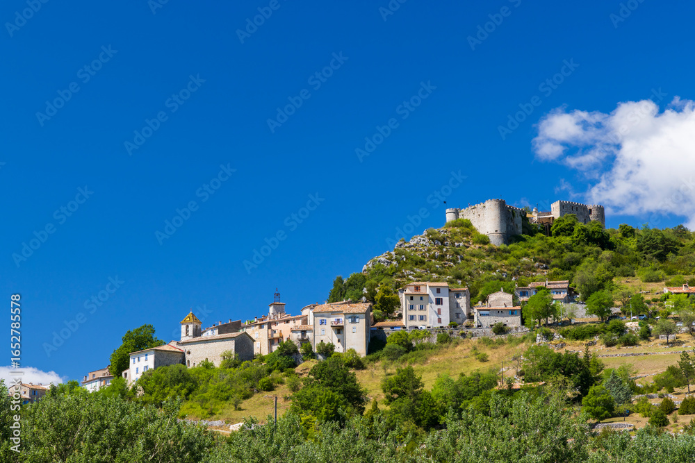 Obraz premium Trigance village with its castle dominating the landscape in Provence, France