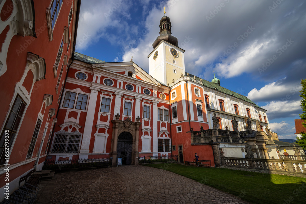 Naklejka premium Broumov Monastery standing tall under a cloudy sky in Czechia