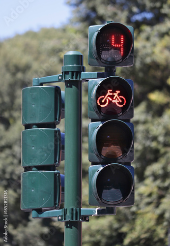 Red traffic light for bicycles with countdown timer.