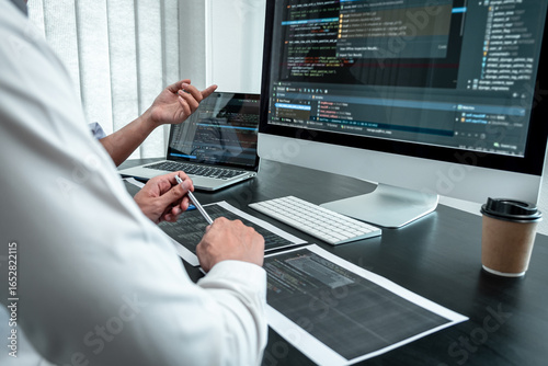 Team of Programmer working in software javascript computer in IT office, Writing codes and data code website and coding database technologies to find solution to problem