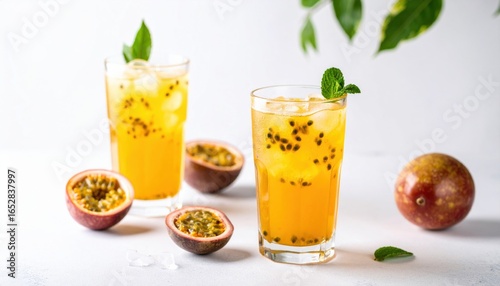 Refreshing Passion Fruit Cocktail with Mint Garnish Served in Elegant Glasses on a Vibrant Tabletop