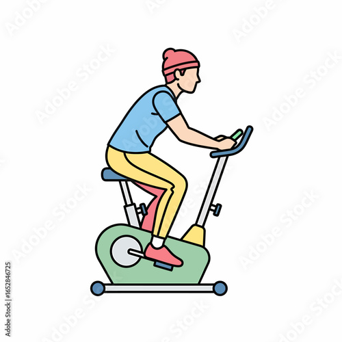 Young man in a pink beanie and colorful sportswear riding a stationary exercise bike.