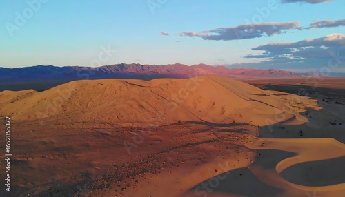 Desert sand dunes at sunset