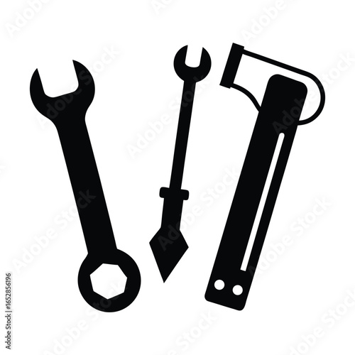 Silhouette illustration of three common hand tools wrench awl and hammer