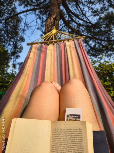 reading in a hammock on a warm summer evening