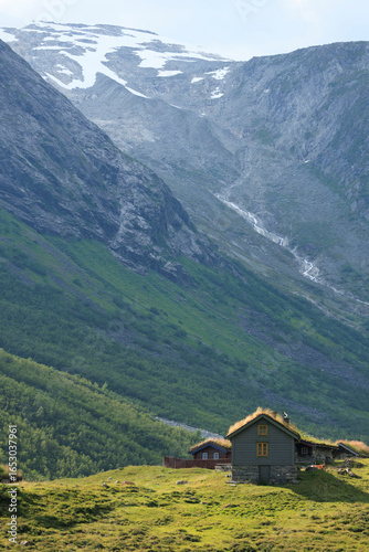 the seter houses up in the nordic rocky mountain with glacier in the background in summer Norway, travel experience