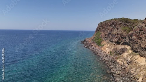 Italian panorama of the Sardinian coast, Capo Nieddu in the colorful height of summer.
