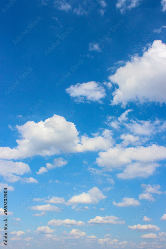 Obraz premium Background with clouds on blue sky. Sky view. Beautiful sunny sky. Clouds on blue sky. Sun shining through the puffy clouds.
