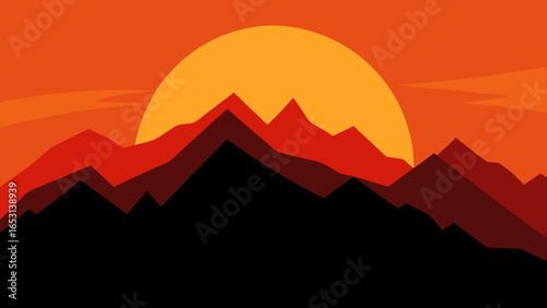 Stunning silhouette of a mountain range against a vibrant fiery sunset sky