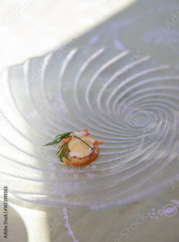Elegant Gourmet Canapé with Salmon, Lemon and Dill on Glass Plate, Minimalistic composition with copy space