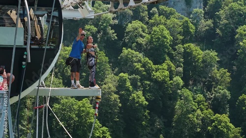 A man jumps bungee with insurance from a suspension bridge in a Sky Park. Sochi, Russia - 13 June 2025
