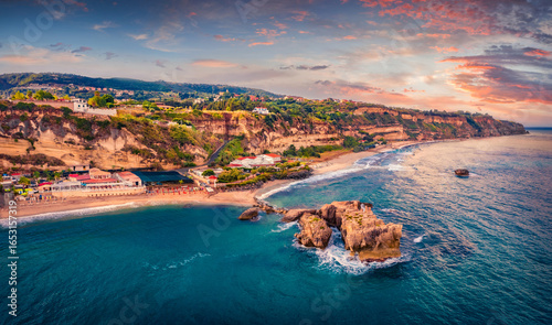 Astonishing summer sunrise on Riachi rocks. Splendid morning scene of Riachi resort, Province of Vibo Valentia, Italy, Europe. Vacation concept background.