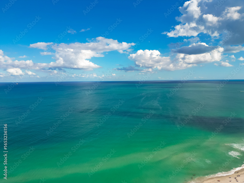 Obraz premium Sea on blue sky with clouds. Sea coastal in Miami, aerial view. Sea beach. Sea pier. Beauty shoreline.