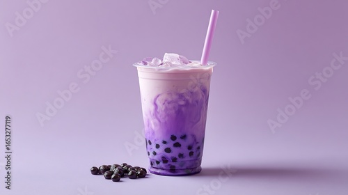 Delicious taro bubble tea drink with tapioca pearls and ice cubes on a purple background perfect aesthetic drink