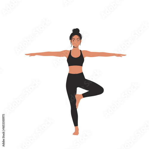 Woman in black sportswear practicing yoga in tree pose on white background