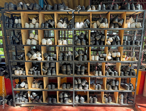Wallpaper Mural Shoes of people praying in a rack. Torontodigital.ca