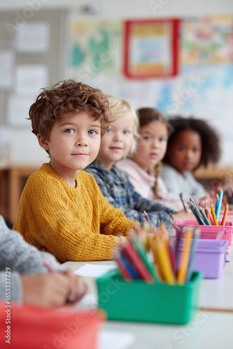 Diverse children in classroom setting. Focus on learning, creativity, and community. Perfect for educational materials, diversity initiatives, and childhood development.