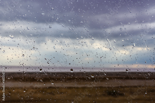 Water drops on a car glass. Raining weather