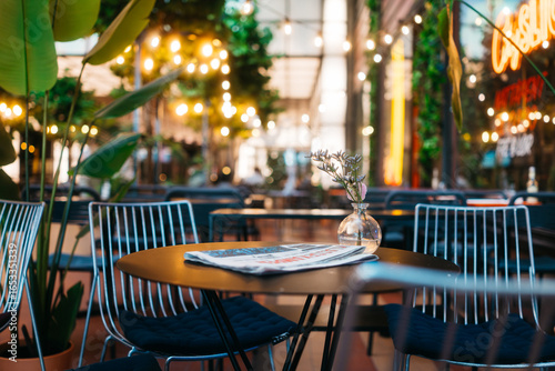 Chic Outdoor Cafe with Ambient Lighting and Stylish Decor