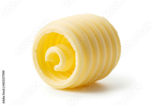 A single curl of creamy yellow butter on a white background