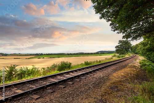 Sunrise over single railway track in Norfolk