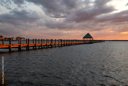 Wooden Fishing Pier at Sunset over the Bay in Ocean City, Maryland