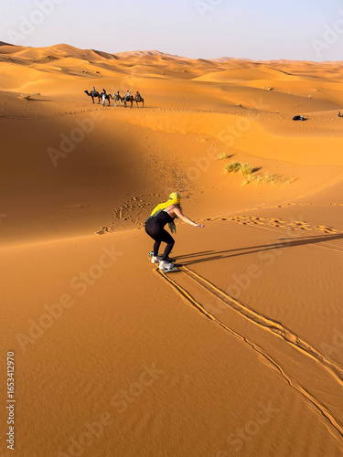Woman Sandboading in the Sahara Desert