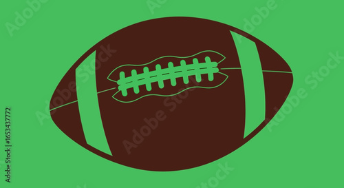Classic American football on a green isolated background.