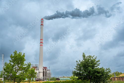 Prague, Czech Republic, August 6, 2023. The Malešice waste-to-energy plant. The tall chimney emits a visible plume of steam.