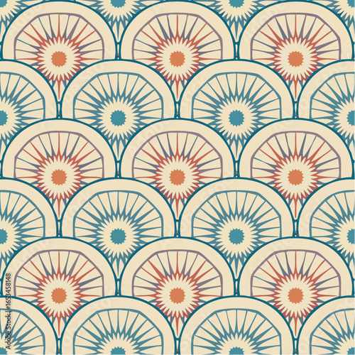  Overlapping retro circle and starburst pattern in muted teal dusty rose and coral pink conjures mid-century graphic elegance across timeless decorative tile surfaces