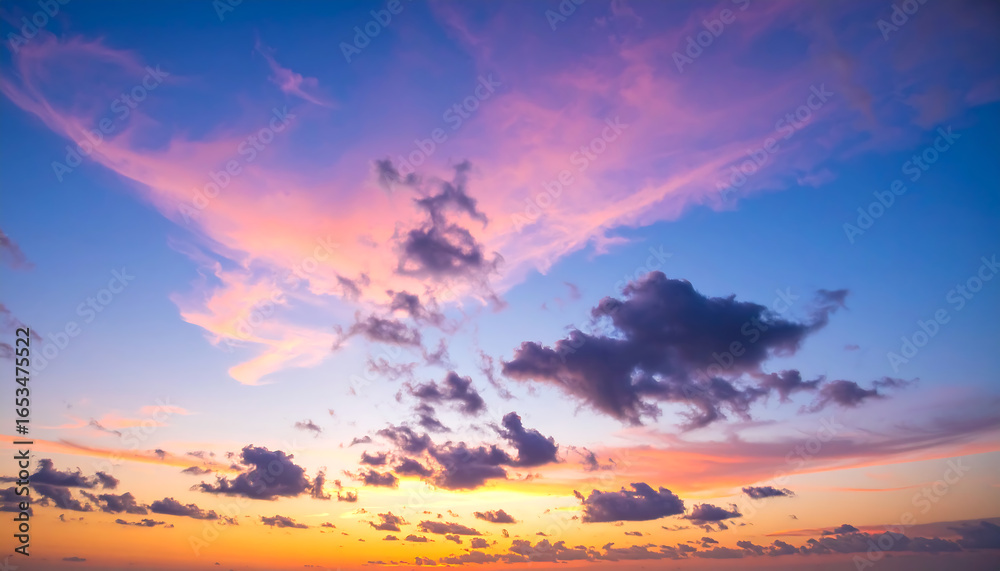 Fototapeta premium Vibrant Sunset Sky: Dramatic Pink, Orange, and Purple Hues with Scattered Clouds, Serene and Peaceful Evening Atmosphere.
