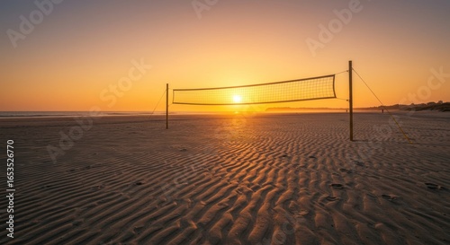 Golden Hour Beach Volleyball: Serene Sunset Over Rippled Sand and Net Silhouette