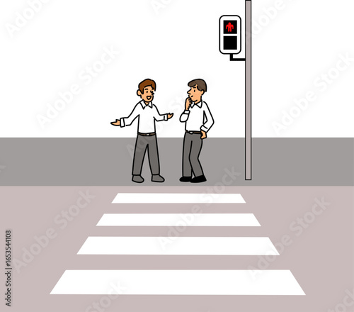 横断歩道で信号待ちする会社員
