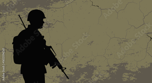 Silhouette of a soldier armed against a cracked wall surface background