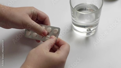 taking medicine painkiller pills on hand capsules health care medicare pharmacy and treatment concept close up