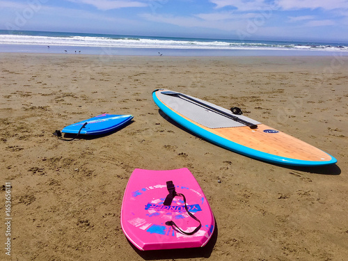 Photography Paddleboard and Bodyboards on Sandy Beach