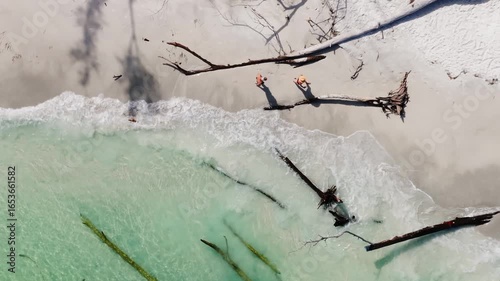 Small waves gently lap the shoreline of Long Boat Key on Florida's gulf coast.
