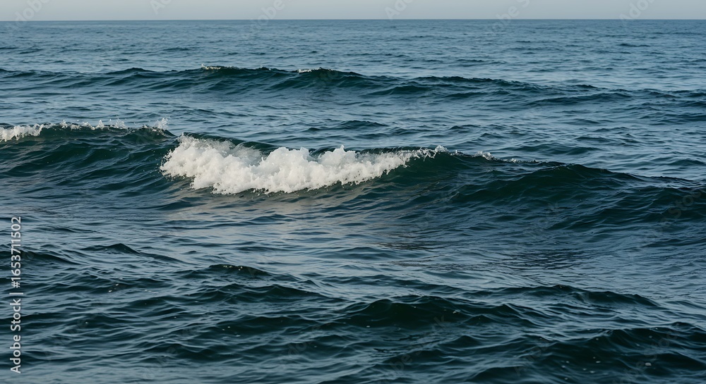 Fototapeta premium Calm Ocean Waves Rolling in Deep Blue Sea Under Clear Sky