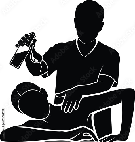 Therapist applying oil during massage therapy session