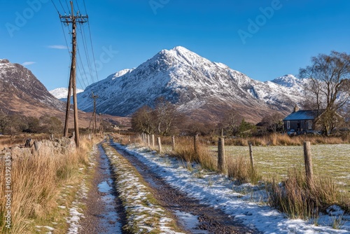 Snowy mountain vista, country lane