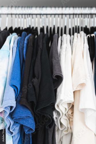 organised wardrobe with flocked hangers and colour coded tops, declutter and tidy up your home