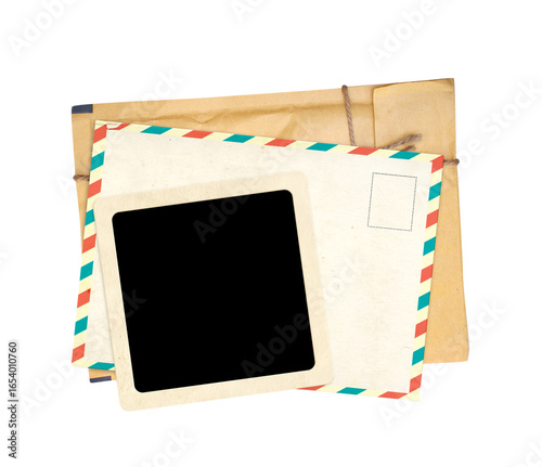Top view of vintage paper envelope, retro postcard and blank photo frame. Nostalgic scrapbooking template is perfect way to express creativity and evoke a sense of warm memories. Isolated on white