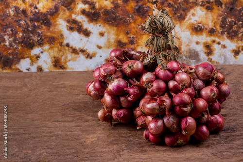 Shallot onions on old wooden background