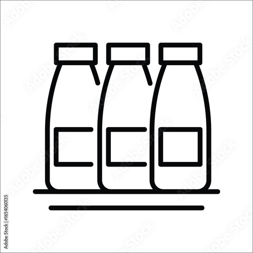 Three milk bottles lined up on a base