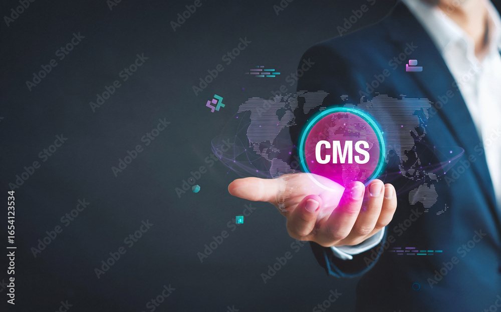 Fototapeta premium Businessman holding CMS for Content Management System technology.