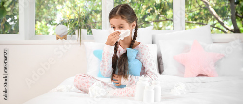 Sick little girl with hot w...