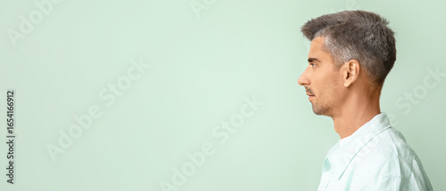 Man with graying hair on co...