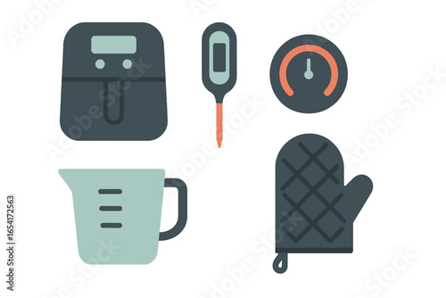 Modern kitchen appliances and tools for cooking and baking, featuring air fryer, thermometer, timer, and oven mitt