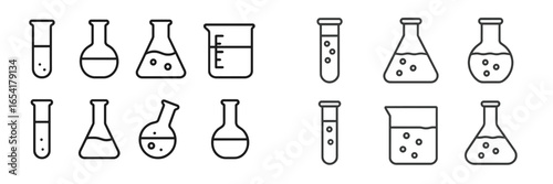 Assorted laboratory glassware including various flasks and beakers on a clean surface