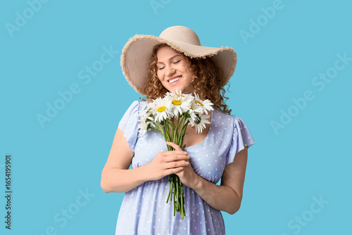 Happy young woman with bouq...
